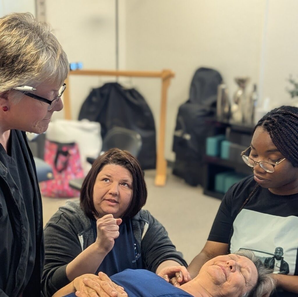 massage school Phoenix AZ hands on massage training students